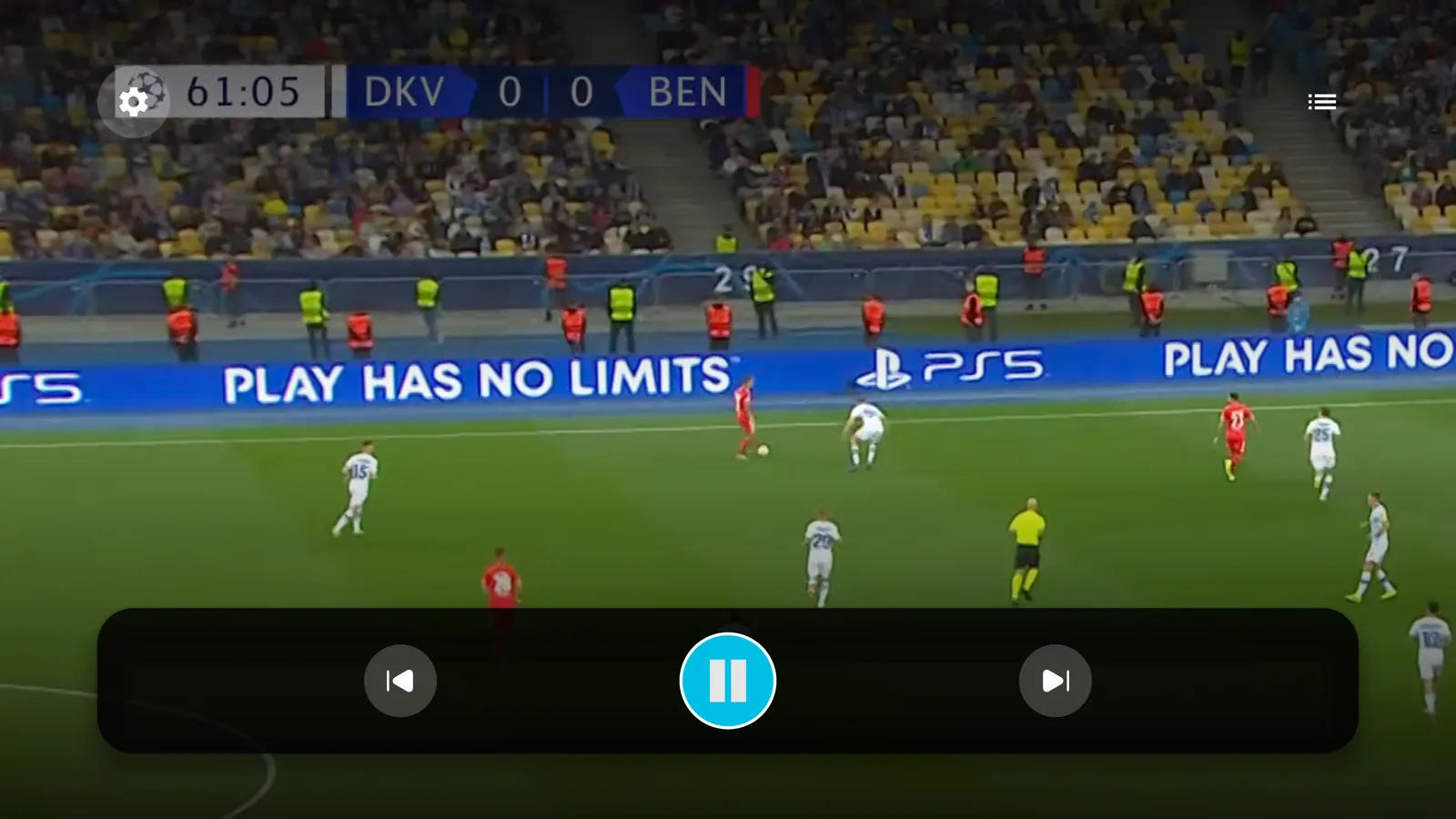 Android TV player showing a live football match with a playback control bar at the bottom with previous, pause and next buttons